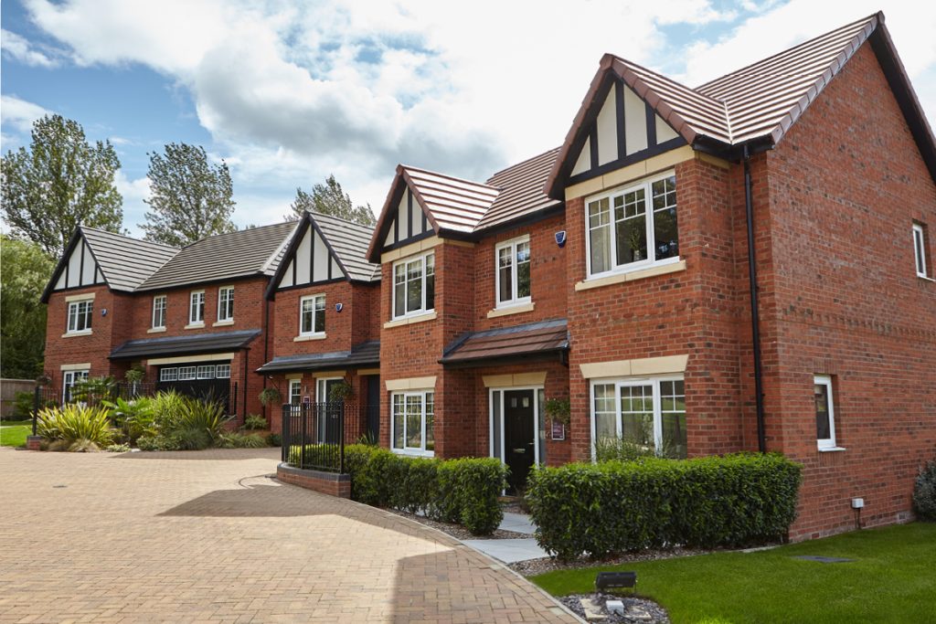 houses with white upvc casement windows and black composite door - Ace Double Glazing